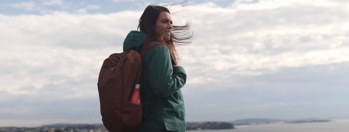 Laura Wells on a hike along a beach.