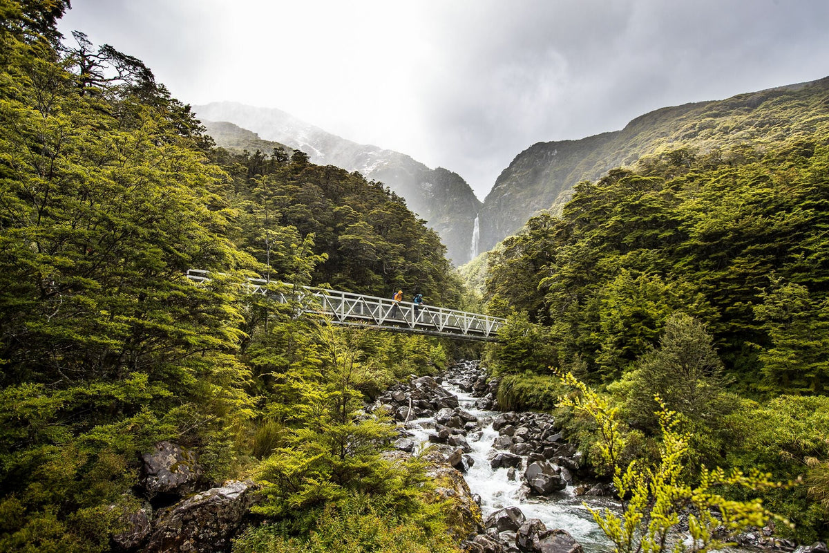 Two people hiking in wet weather
